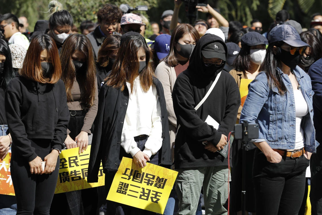 Pro-democracy supporters pause during a rally by the advertising industry in Hong Kong on Monday, Dec. 2, 2019. (AP)