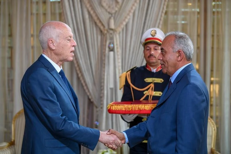 Tunisian President Kais Saied shakes hands with Prime Minister designate Habib Jemli in Tunis, Tunisia, in this handout pictured obtained by Reuters on November 15, 2019. (Reuters)