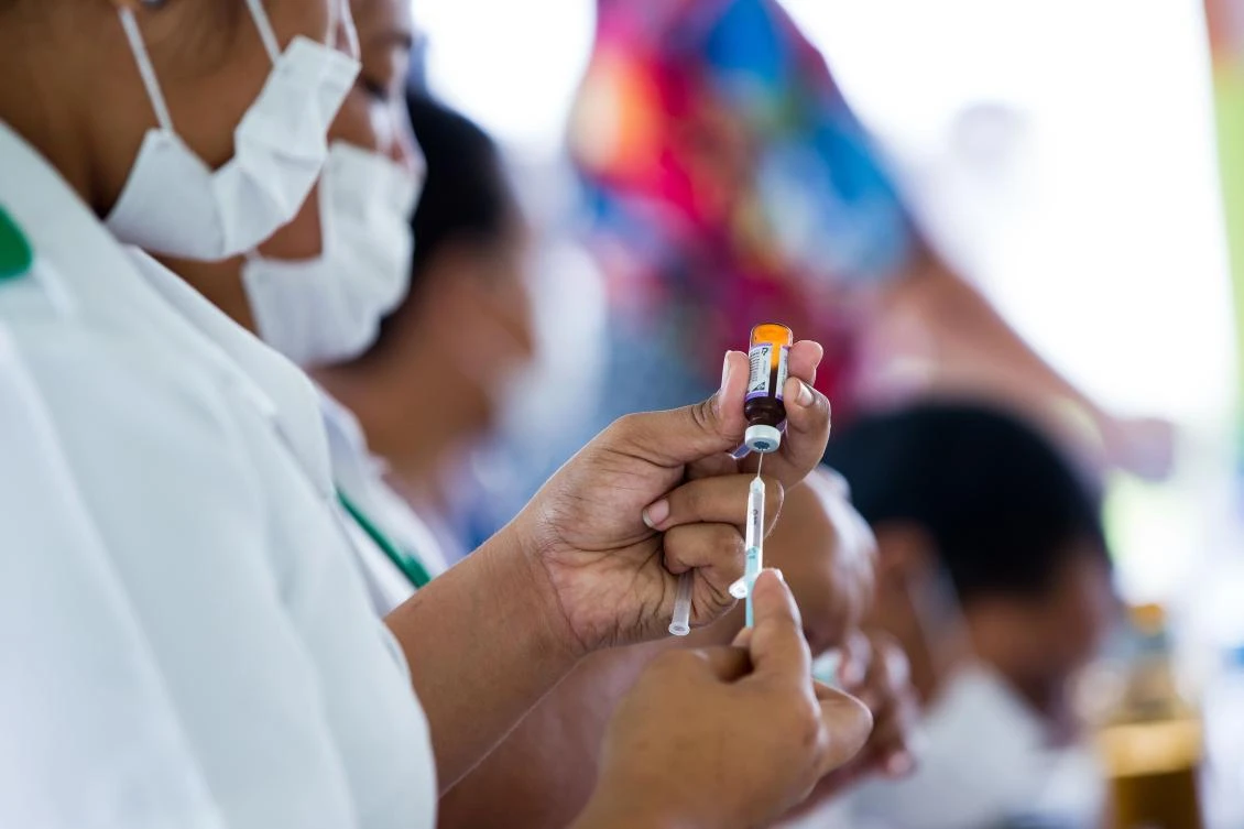 This handout picture taken on December 2, 2019 and released from UNICEF Samoa on December 4 shows nurse April Wilson (L) and team leader Luisa Popo preparing vaccinations during a nationwide campaign against measles in the Samoan town of Le'auva'a. (File/AFP)