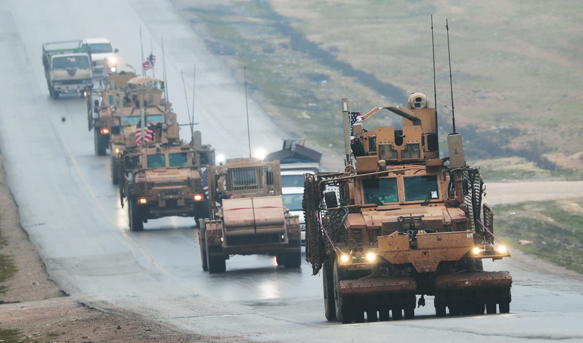 A convoy of US military vehicles is seen in Syria’s northern city of Manbij. American troop levels in the country have fallen about 40 percent from around 1,000 after military pullback decision. (File/AFP)