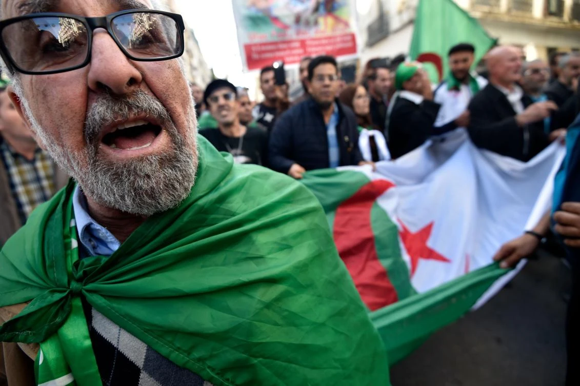 Algerians chant slogans as they march during an anti-government demonstration in the Algerian capital Algiers on December 6, 2019, ahead of the presidential vote scheduled for December 12. (AFP/Ryad Kramdi)