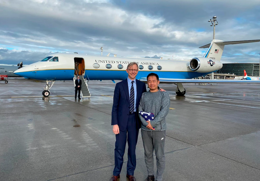 US special representative for Iran, Brian Hook greets Xiyue Wang in Zurich, Switzerland after he was released by iran in a prisoner swap. (AP)