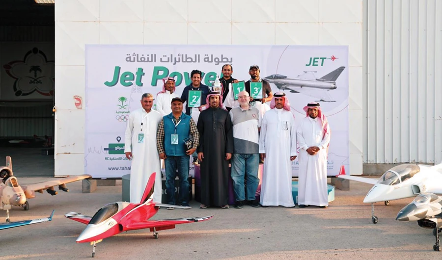The president of the Saudi Wireless and Remote Control Sports Federation, Saud Al-Fagam, third from left, with the winners of a tournament. (SPA)