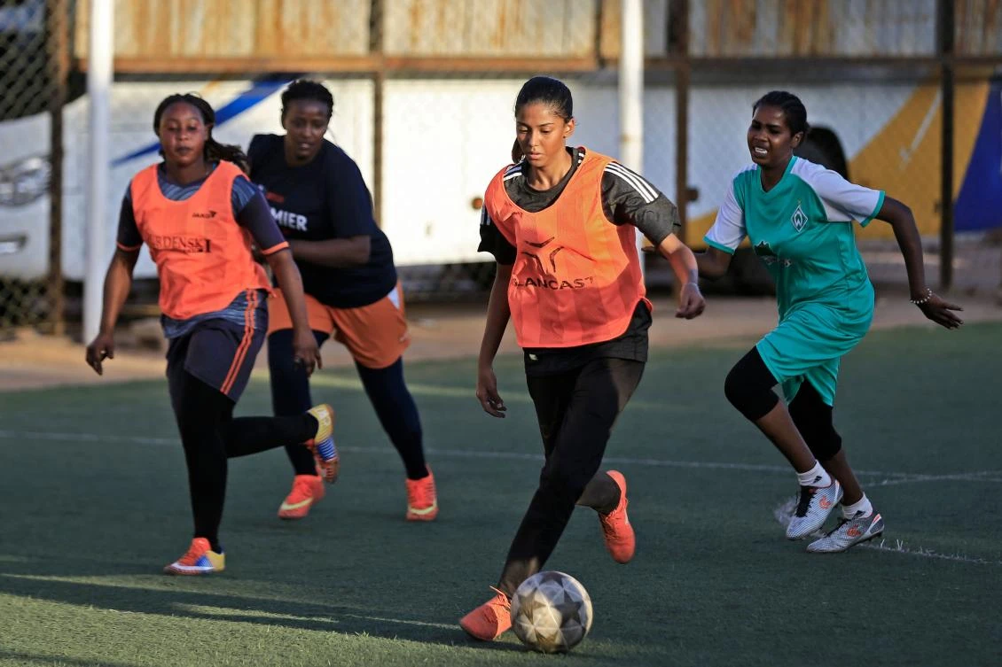 Sudanese woman football player Orjuan Essam (C), 19, takes part in a training session at a stadium in the Sudanese capital Khartoum on November 20, 2019. (AFP)