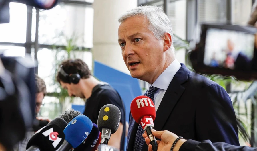 Finance Minister Bruno Le Maire speaks to media. Paris has long complained about US companies not paying enough tax on revenues earned in France. (AFP)