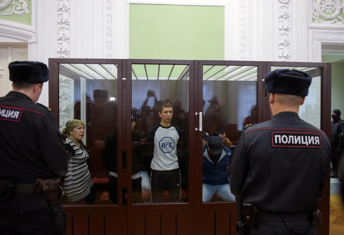 Abror Azimov, accused of involvement in the Saint Petersburg metro bombing, looks on while standing inside a defendants' cage during the sentencing hearing at a court in Saint Petersburg on December 10, 2019 (AFP)