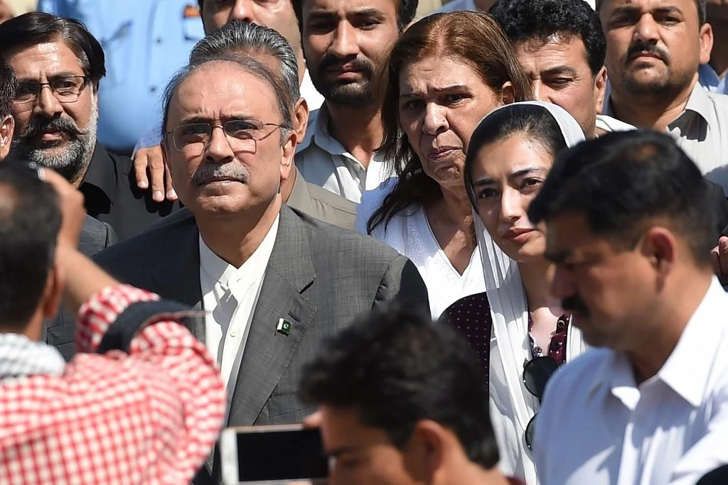 Former President Asif Ali Zardari, second left, the widower of assassinated former Prime Minister Benazir Bhutto, was earlier arrested in a multi-million-dollar money laundering case. (AFP)