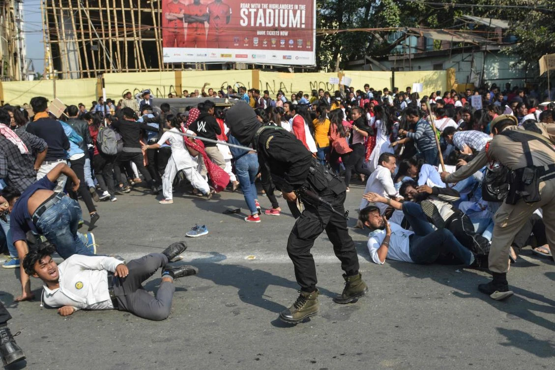 Security personnel use batons to disperse students protesting against the governments Citizenship Amendment Bill (CAB), in Guwahati on December 11, 2019. (File/AFP)