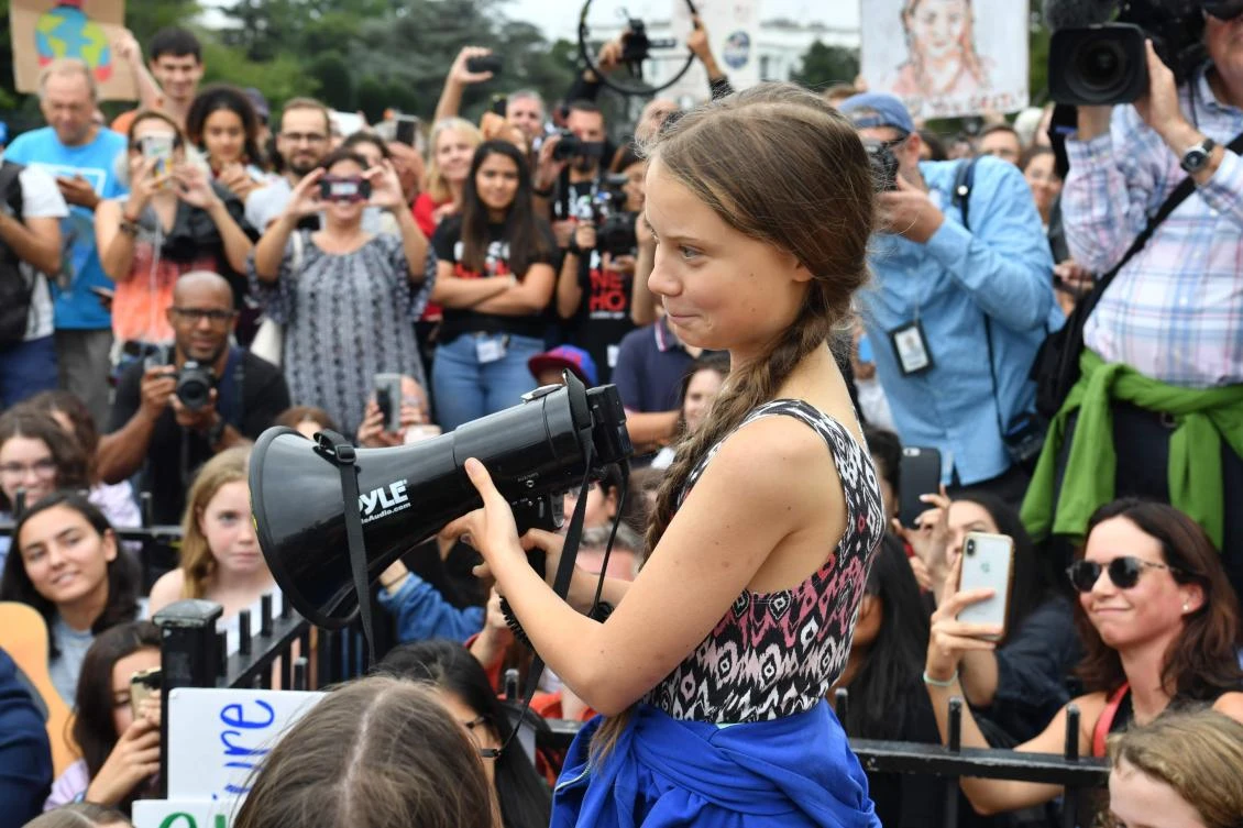 In this file photo taken on September 13, 2019 Swedish environment activist Greta Thunberg speaks at a climate protest outside the White House in Washington, DC. (AFP)