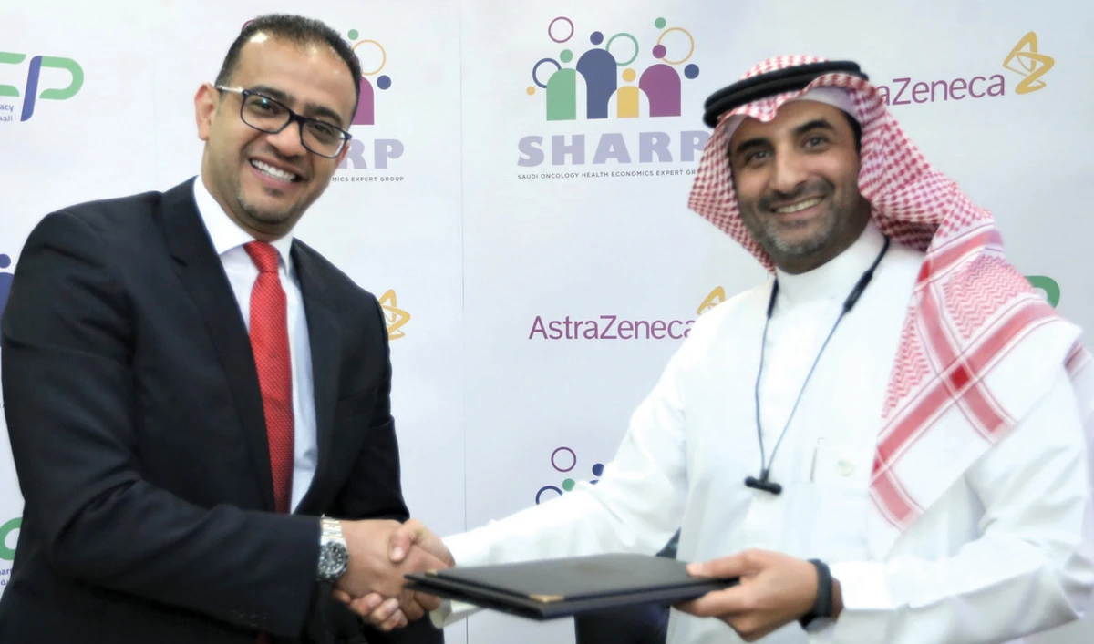 Saudi Society of Clinical Pharmacy President Dr. Ahmed Al-Jedai, right, and AstraZeneca’s GCC Regional President Dr. Ismail Shehada during the signing of the agreement to establish SHARP. (Photo/Supplied)