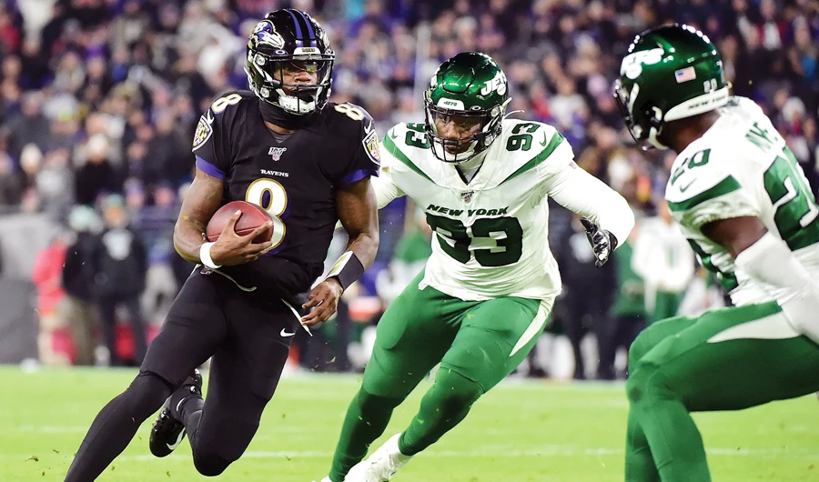 Ravens’ quarterback Lamar Jackson scrambles against the New York Jets during the first half of a game in Baltimore. (AP)