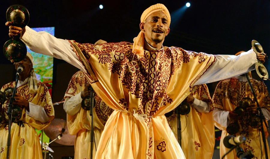In this file photo, a member of Gnaoua (Gnawa) group performs in Essaouira at the Gnaoua World Music Festival. Gnawa culture, a centuries-old Moroccan practice rooted in music, African rituals and Sufi traditions, was on December 12, 2019 added to UNESCO's list of Intangible Cultural Heritage of Humanity. (AFP)