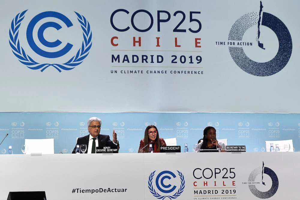 Chile’s Minister of Environment and COP25 president Carolina Schmidt (C) attends the closing plenary session of the UN Climate Change Conference COP25 at the ‘IFEMA — Feria de Madrid’ exhibition center, in Madrid, on Dec. 15, 2019. (AFP)
