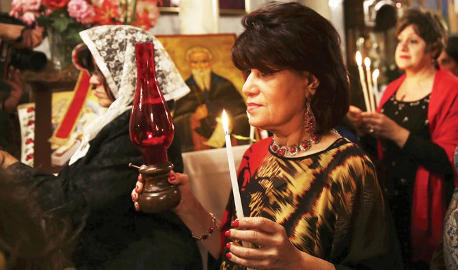 Orthodox Christian worshippers hold candles during the Easter Eve service at the St. Porphyrios church in Gaza City. (AP)