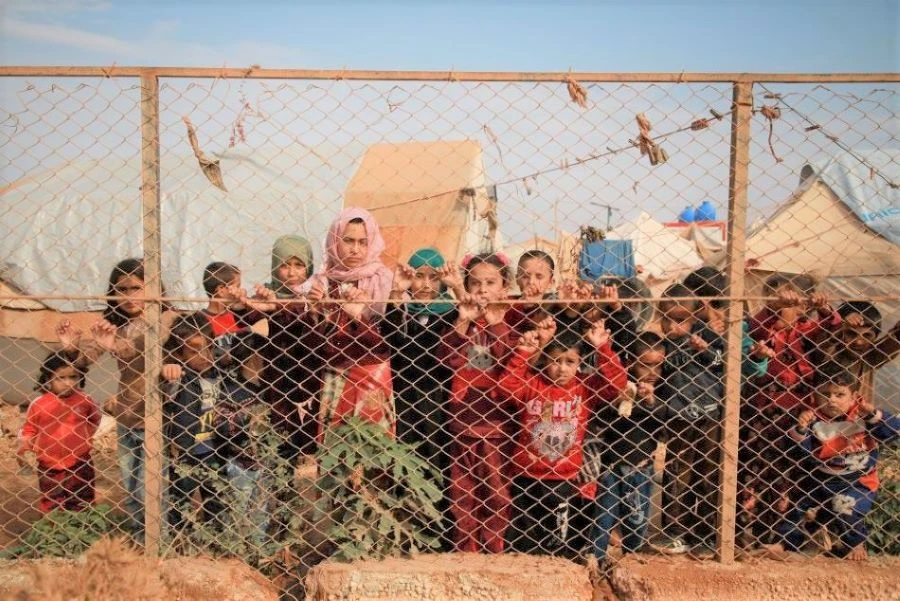 As many as 60 children born under the Daesh ‘caliphate’ in Iraq and Syria, but who are legal UK citizens, are currently living in the region, in many cases with their mothers. Their future remains in the balance. (AFP)