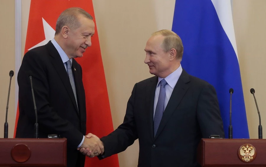 Russian President Vladimir Putin (R) and his Turkish counterpart Recep Tayyip Erdogan shake hands during a joint press conference following their talks in the Black sea resort of Sochi on October 22, 2019. (File/AFP)