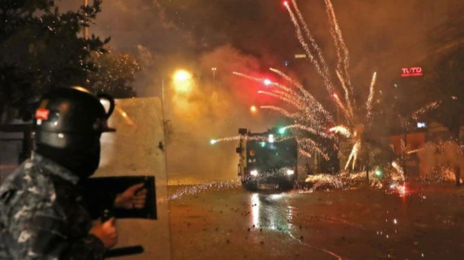 Shia youths set cars ablaze and threw stones and fireworks at police. (AFP)