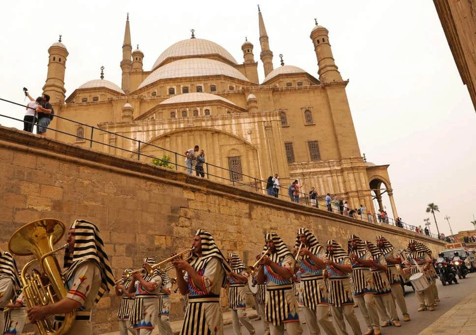 Tutankhamun’s chariot is transported past the Cairo Citadel to a new museum at the Pyramids of Giza, last year. (AFP)
