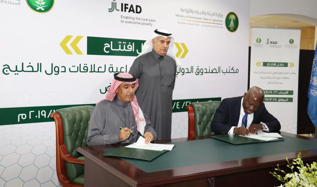 Minister of Environment, Water & Agriculture Abdulrahman Al-Fadhli (standing) & IFAD President Gilbert Houngbo (sitting right) signing agreement. (AN photo)