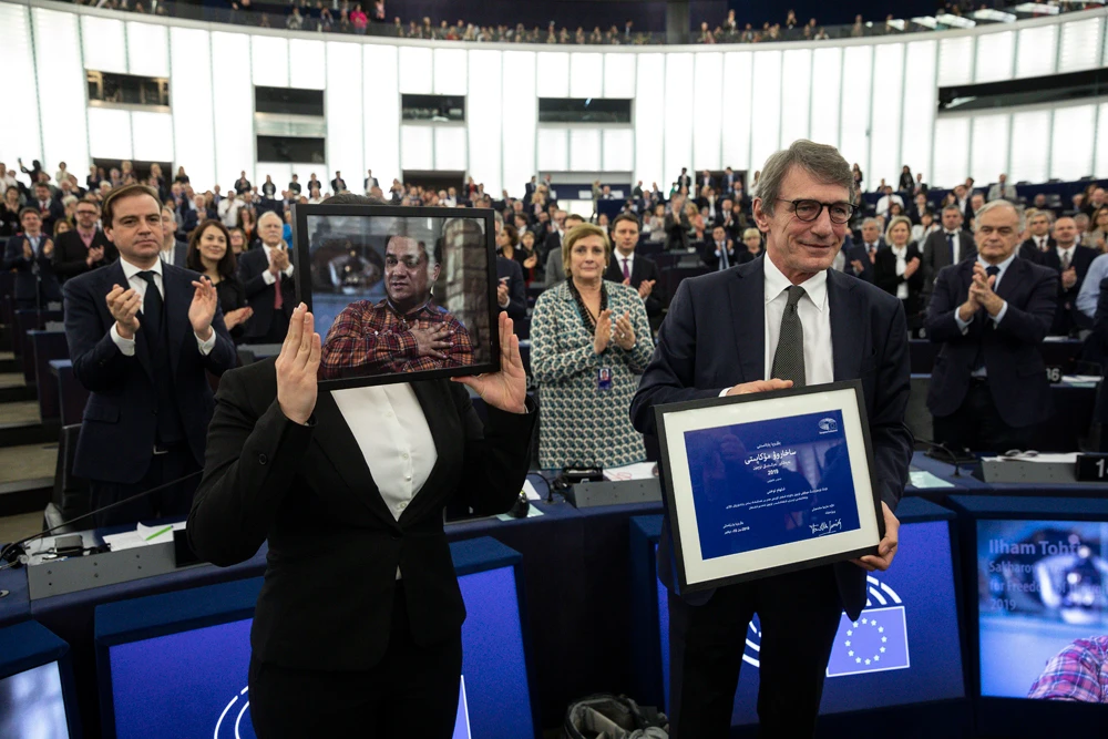 Jewher Ilham, daughter of imprisoned Uighur scholar Ilham Tohti, and European Parliament President David Sassoli attend the Sakharov Prize ceremony at the European Parliament, in Strasbourg. (AP Photo)