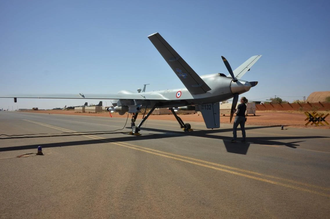 An US contractor checks a French armed Reaper drone before take-off at the operation Barkhane’s military base in Niamey, on December 15, 2019. (AFP)