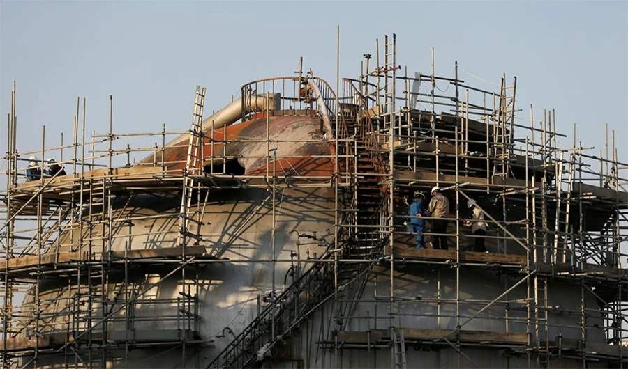 Workers are seen at the damaged site of Saudi Aramco oil facility in Abqaiq, Saudi Arabia, September 20, 2019. (REUTERS/File Photo)