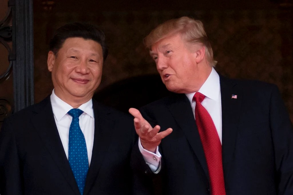 In this file photo taken on April 06, 2017 US President Donald Trump (R) welcomes Chinese President Xi Jinping (L) to the Mar-a-Lago estate in West Palm Beach, Florida. (AFP)