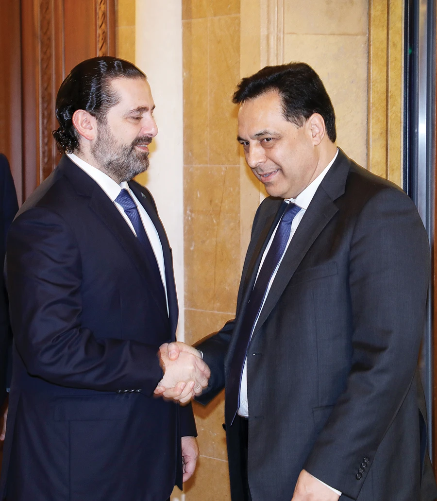 Outgoing Lebanese PM Saad Hariri meets with PM-designate Hassan Diab, in Beirut on Friday. (Photo/Supplied)