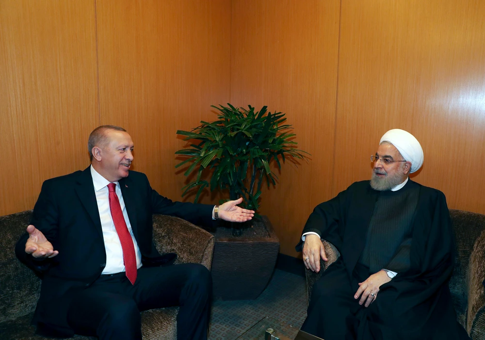 Turkey's President Recep Tayyip Erdogan, left, gestures as he talks to Iran's President Hassan Rouhani during their meeting at the sidelines of the Kuala Lumpur Summit in Kuala Lumpur, Malaysia, on Dec. 19, 2019. (Presidential Press Service via AP, Pool)