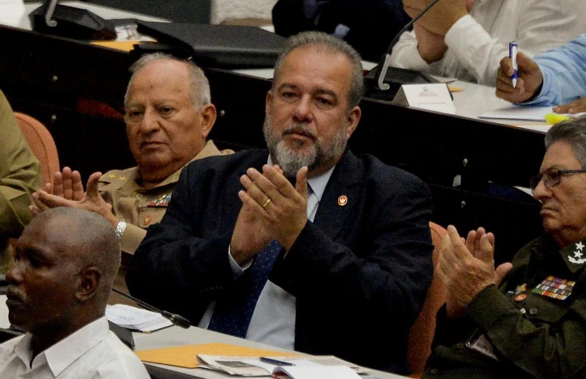 The appointment of as prime minister of Manuel Marrero Cruz, center, is part of a process of Cuba’s decentralization and generational change from the revolutionary old guard. (AFP)
