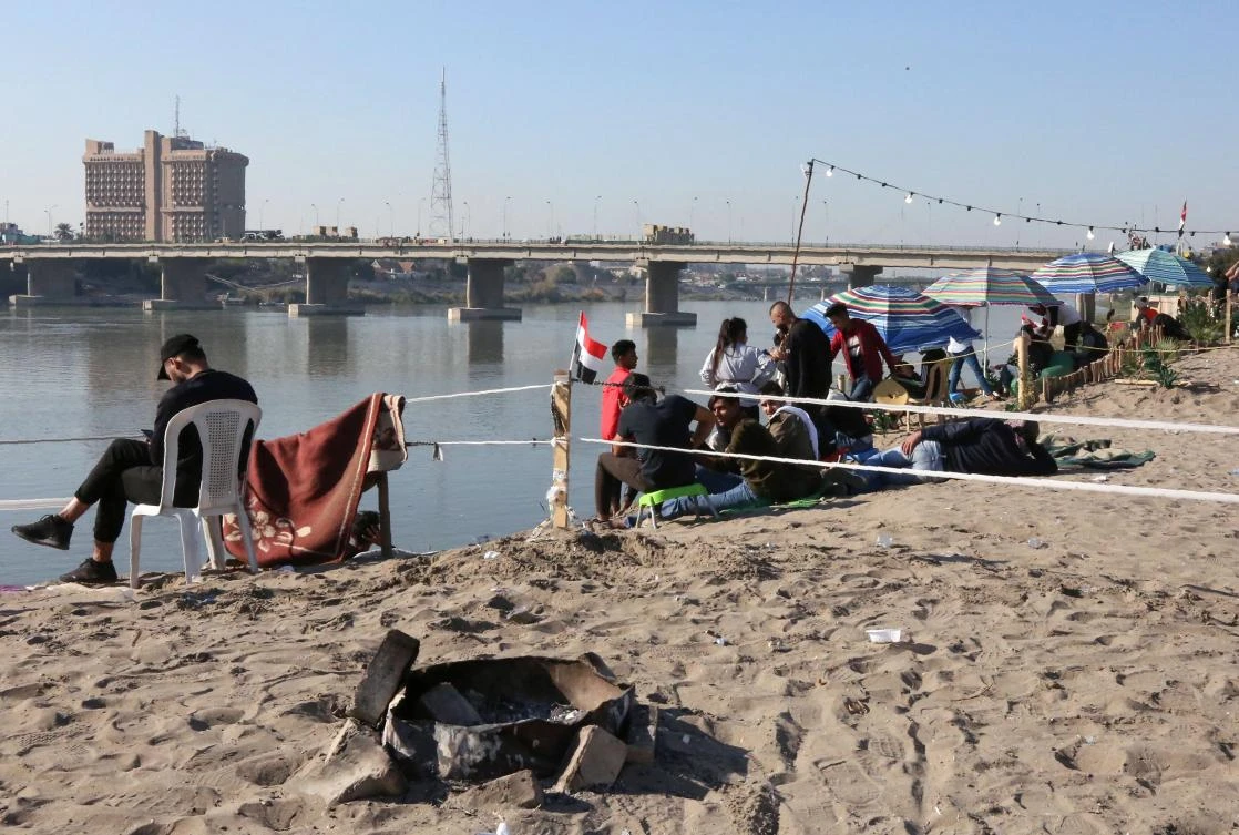 In the heart of Baghdad, a few steps from the famed Tahrir Square, the post-Saddam generation continues its revolution in a festive atmosphere at "the beach", a stretch of sand of around 500 metres on the eastern bank of the Tigris river, where hip hop, beach football and shisha provide the entertainment. (AFP)