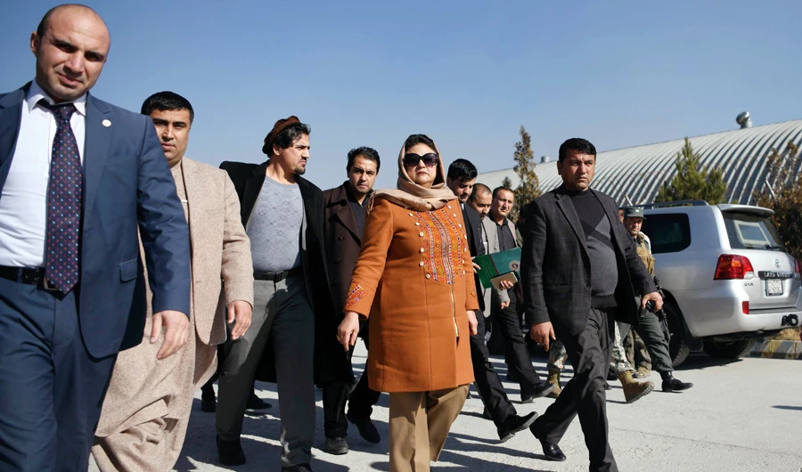 Hawa Alam Nuristani, head of the Afghan Independent Election Commission, leaves after announcing the preliminary elections results during a press conference in Kabul. (AFP)