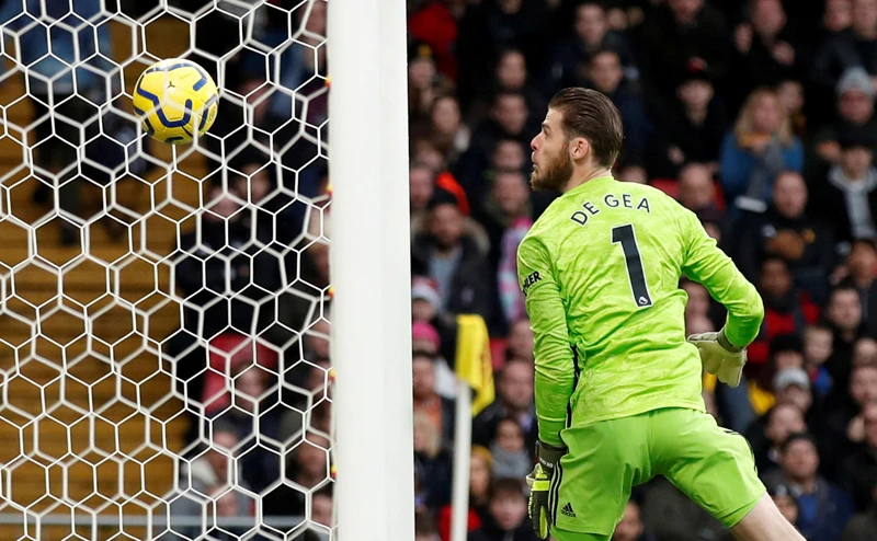 Manchester United's goalkeeper David de Gea reacts after Watford's Ismaila Sarr scores their first goal. (Reuters)