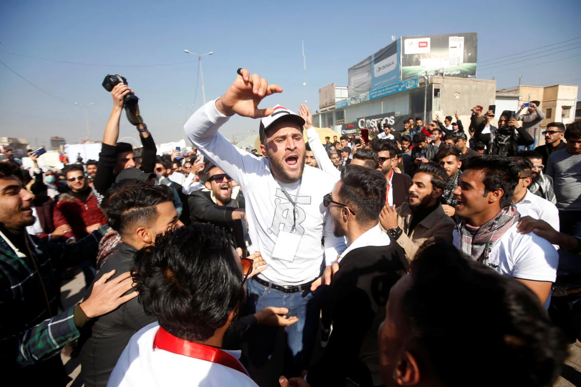 An Iraqi student shouts slogans during ongoing anti-government protests, in Basra, Iraq, December 24, 2019. (Reuters)