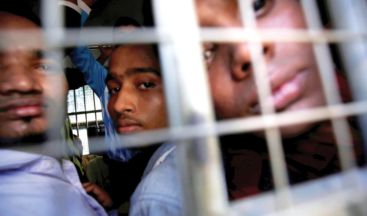 Rohingya Muslim men are transported from a court hearing on charges of illegally travelling without proper documents, in Pathein, Ayeyarwady, Myanmar. (Reuters/File)