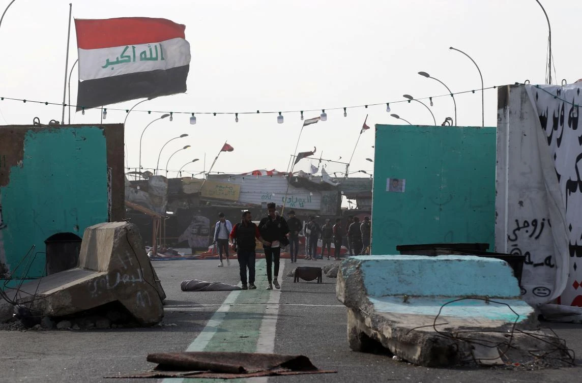 This picture taken on December 25, 2019 shows a view of concrete barriers forming a barricade along Senak bridge in the Iraqi capital Baghdad. (AFP)