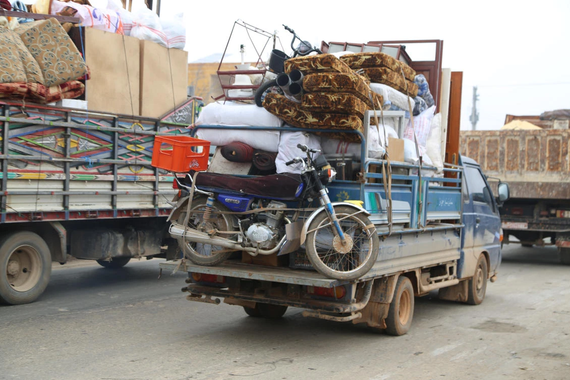 Trucks carry belongings of people fleeing from Maarat al-Numan, in northern Idlib, Syria December 24, 2019. (Reuters)