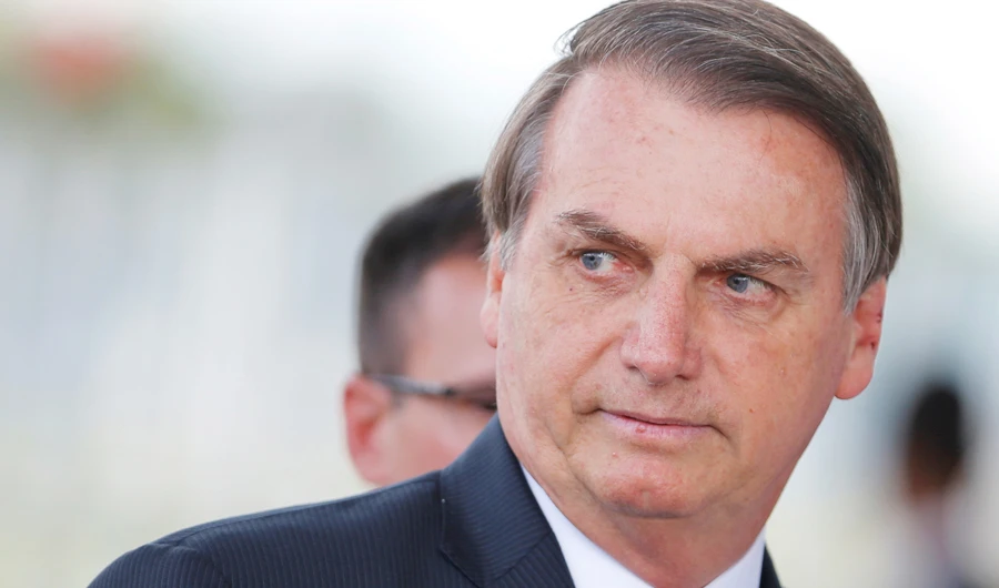 Brazil's President Jair Bolsonaro looks on as he leaves the Alvorada Palace in Brasilia, Brazil December 12, 2019. (REUTERS)