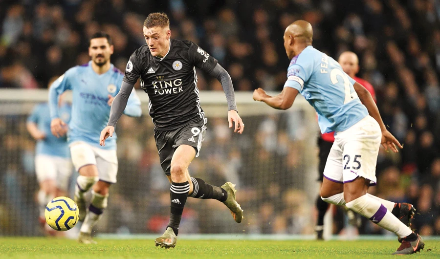 Leicester City’s English striker Jamie Vardy (running with the ball) is unlikely to get involved throughout the festive period. (AFP)