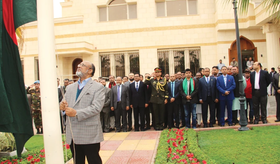 Bangladesh Ambassador Golam Moshi hoists the national flag to full staff.
