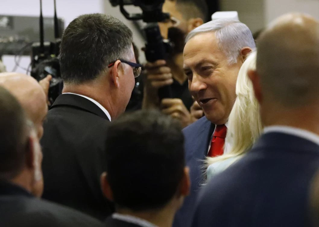 Israeli Prime Minister Benjamin Netanyahu, right, won 72.5 percent of votes in Likud’s party ballot, against 27.5 percent for challenger Gideon Saar, left. (AFP)