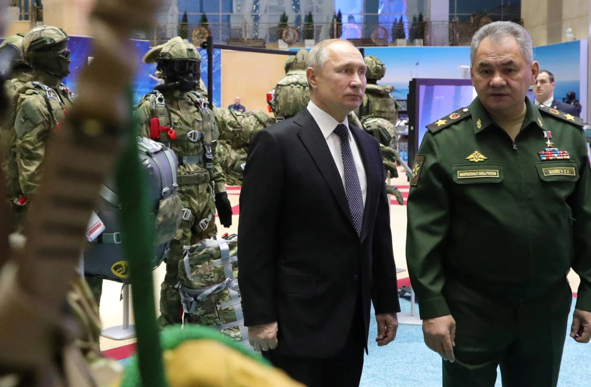 Russian President Vladimir Putin, left, and Defense Minister Sergei Shoigu at a military exhibition in Moscow. (Kremlin via Reuters)