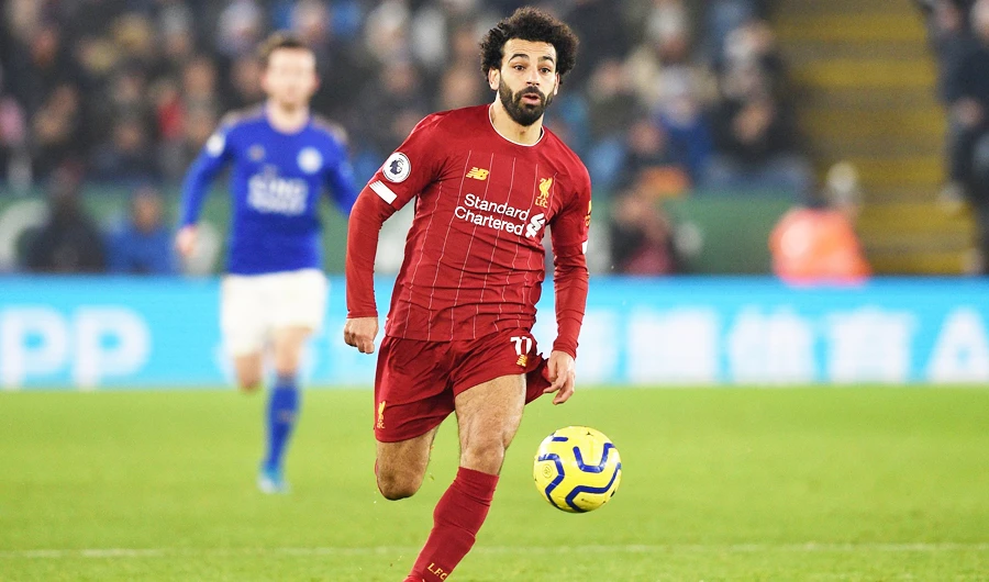 Liverpool’s Egyptian midfielder Mohamed Salah runs with the ball during Thursday’s English Premier League football match. (AFP)