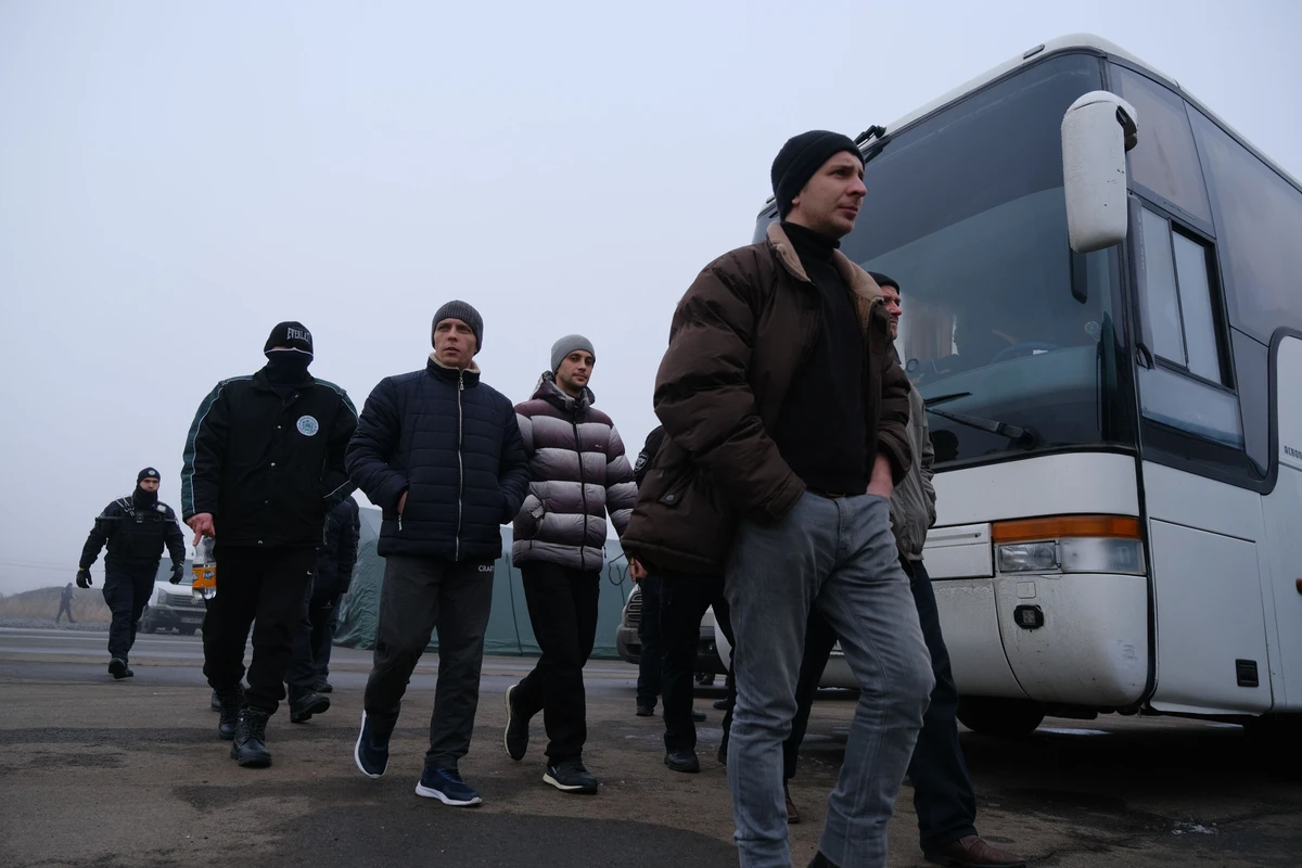 Pro-Russian rebels, above, before a prisoner exchange between Ukraine and pro-Russian separatists near the Mayorsk checkpoint on December 29, 2019. (AFP)