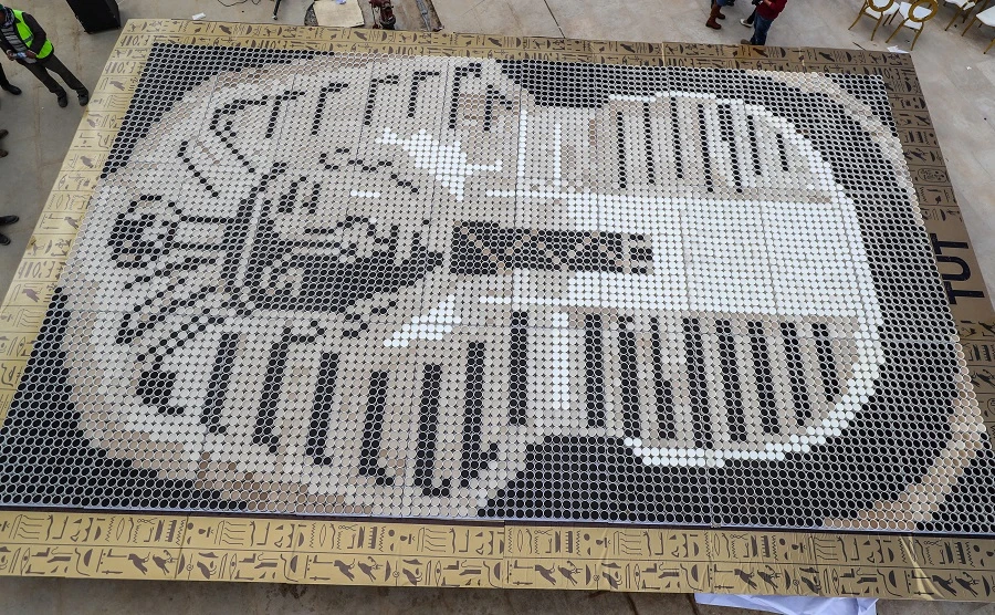 The world's largest coffee cup mosaic of King Tutenkhamun's mask was unveiled in Egypt. AFP