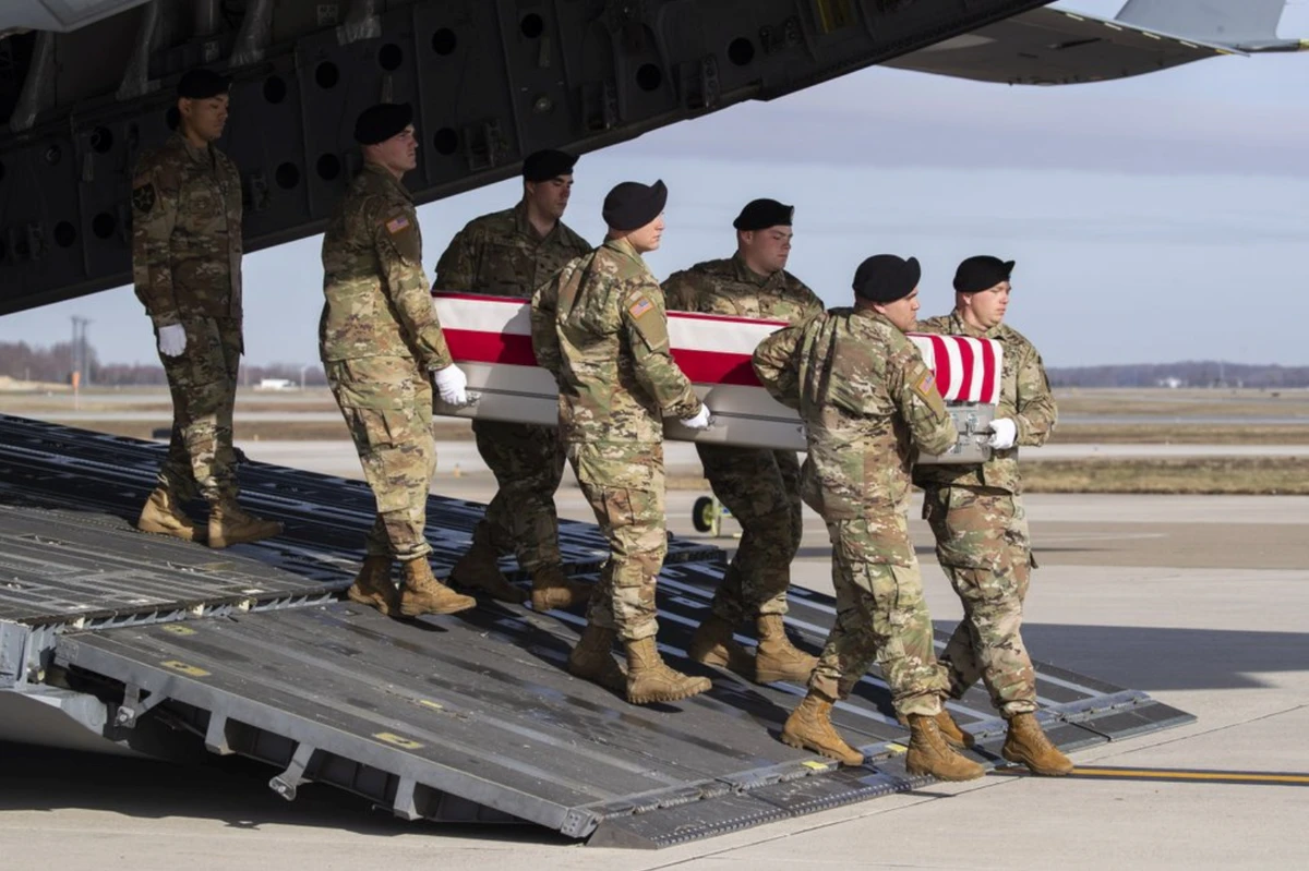 In this Dec. 25, 2019, file photo, an Army carry team moves a transfer case containing the remains of U.S. Army Sgt. 1st Class Michael Goble, at Dover Air Force Base, Del.. Goble, a U.S. Special Forces soldier who died in Afghanistan this week, was seizing a Taliban weapons cache when he was killed, the U.S. military said Friday. (AP / File Photo )