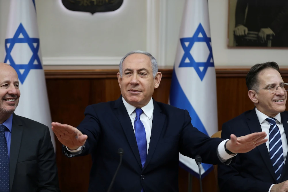 Israeli Prime Minister Benjamin Netanyahu, Minister of Regional Cooperation, Tzachi Hanegbi and Cabinet Secretary Tzahi Braverman attend the weekly cabinet meeting in Jerusalem, Israel, Dec. 29, 2019. (Reuters)