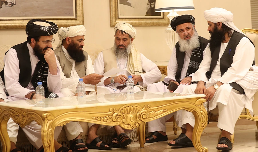 In this photo, Mohammad Nabi Omari (L), a Taliban member formerly held by the US at Guantanamo Bay and reportedly released in 2014 in a prisoner exchange, sits with other members during the second day of the Intra Afghan Dialogue talks in the Qatari capital Doha on July 8, 2019. (AFP)
