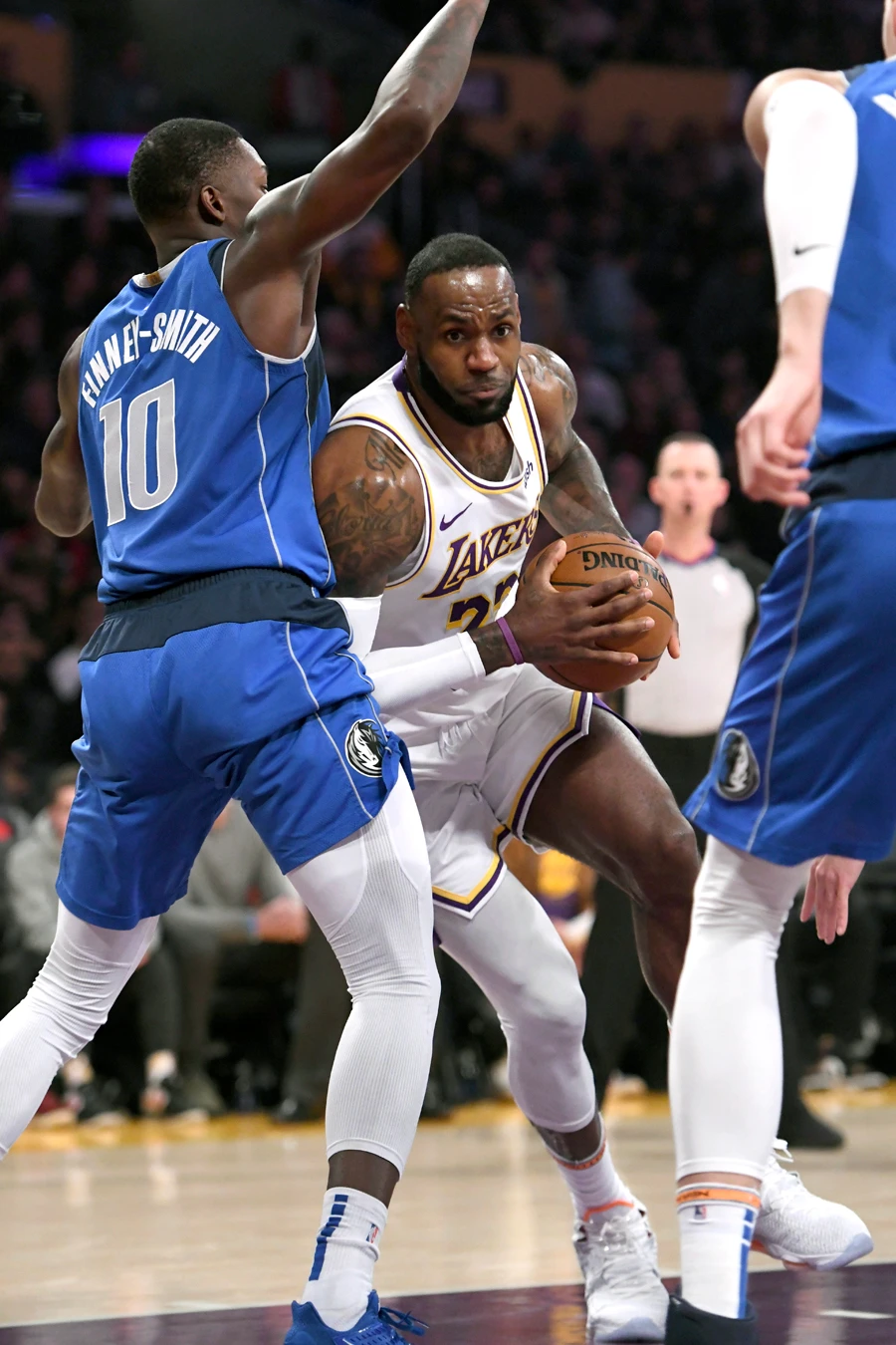 Los Angeles Lakers guard LeBron James drives to the basket against Dallas Mavericks forward Dorian Finney-Smith. (AP)