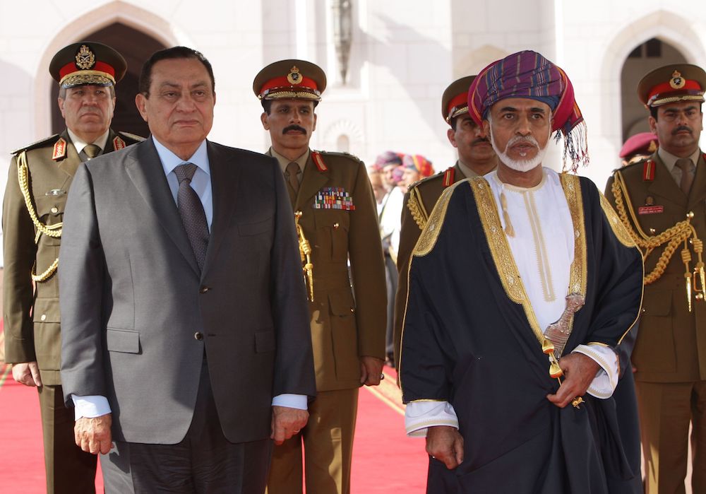 Sultan Qaboos and then Egyptian President Hosni Mubarak listen to the national anthem in Muscat upon the latter's arrival for the Arab summit in 2009. (AFP/FIle)